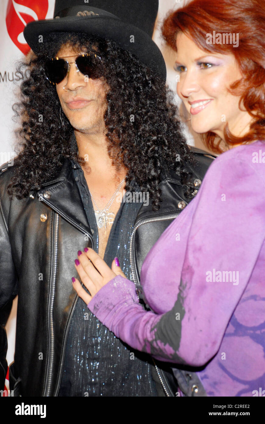 Slash and his wife The 4th Annual MusiCares MAP Fund Benefit Concert at ...