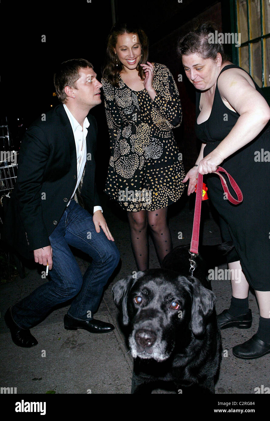 Rob Thomas and a friend say hello to Margaret and her dog Cole while