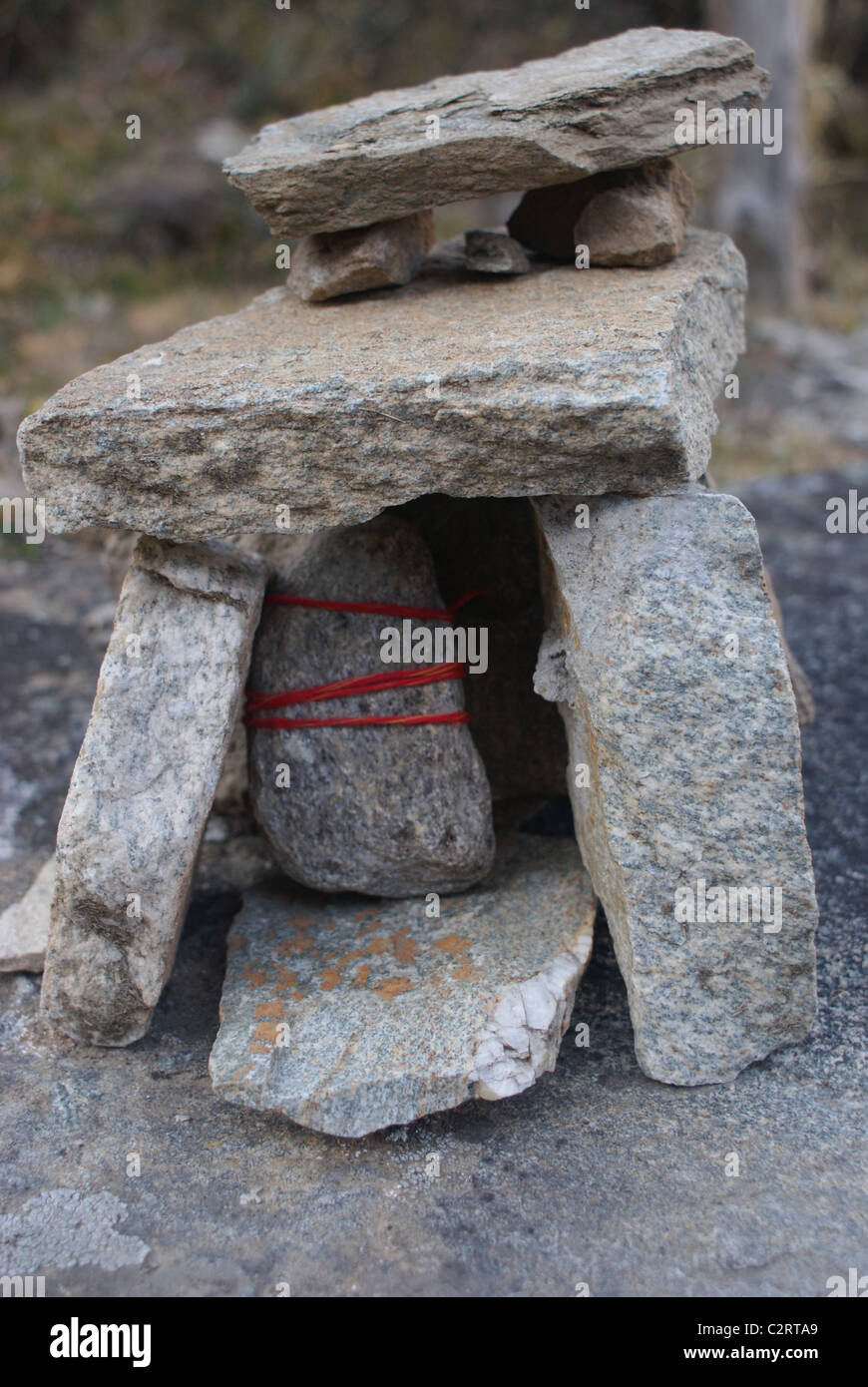 Badrinath, Garhwal Himalayas, India: A pilgrim's offering to Shiva on the trail to Neelkanth. Stock Photo