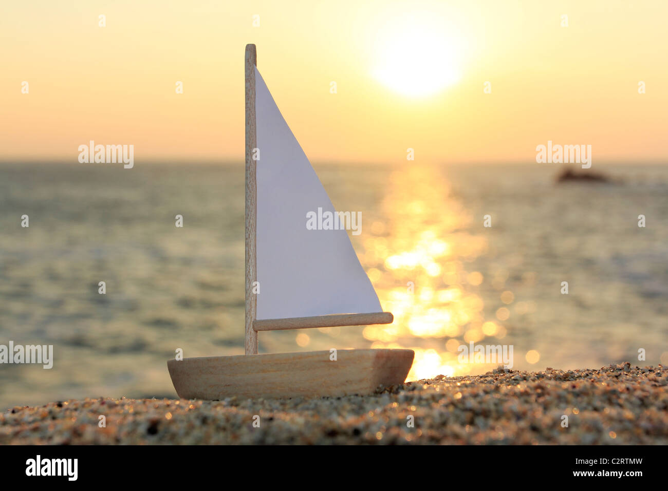 Model boat on beach Stock Photo