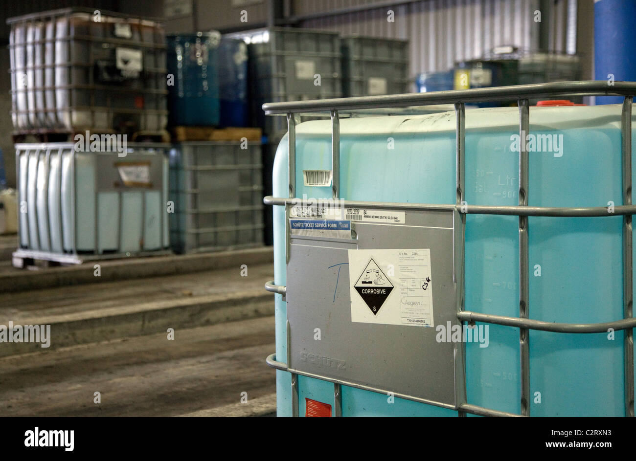 Industrial waste treatment plant, England - containers of waste chemicals Stock Photo