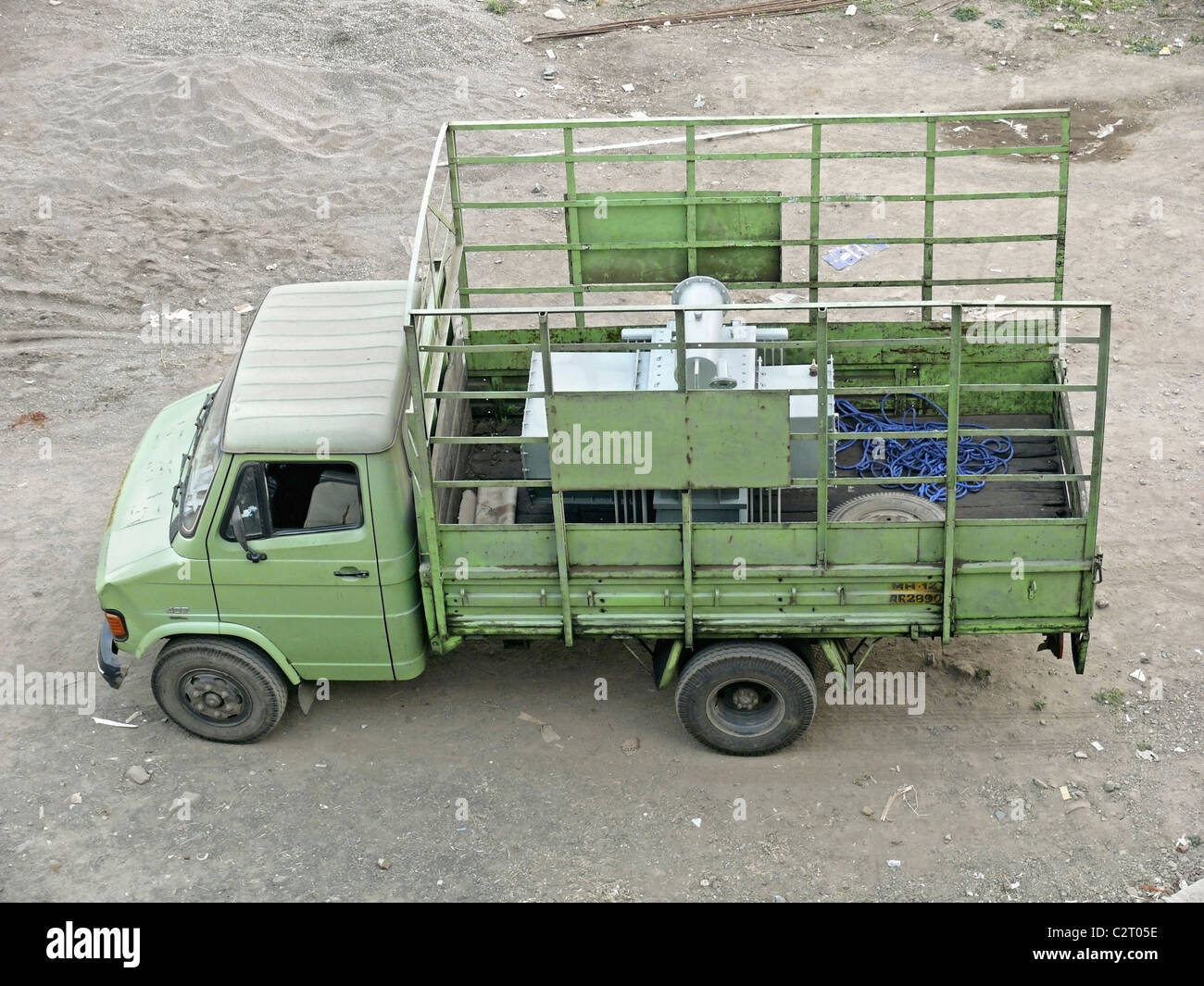 Four wheeled Mini truck carrying electric transformer, pune, Maharashtra, India Stock Photo