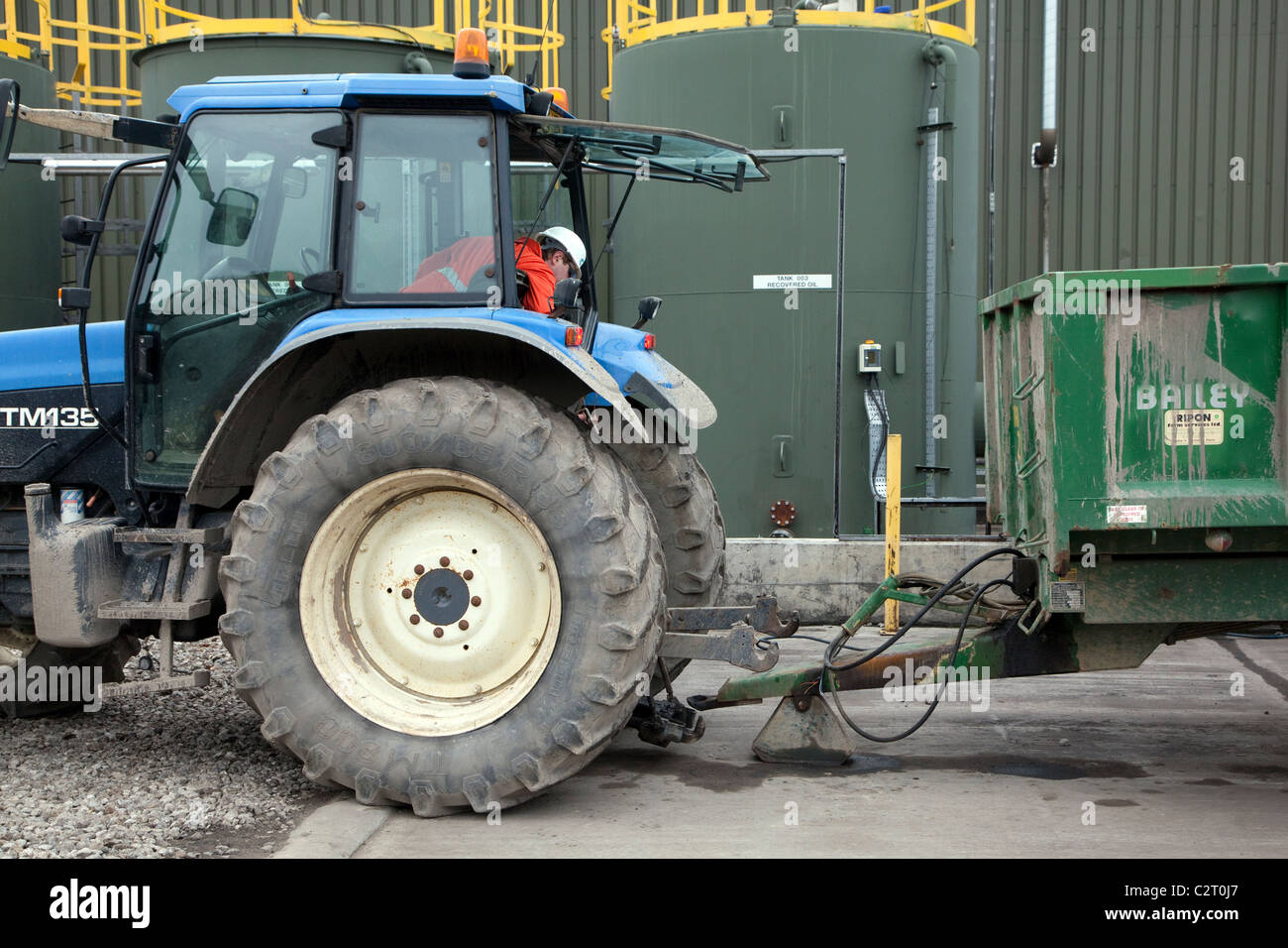 Industrial waste treatment plant, England attaching trailer to