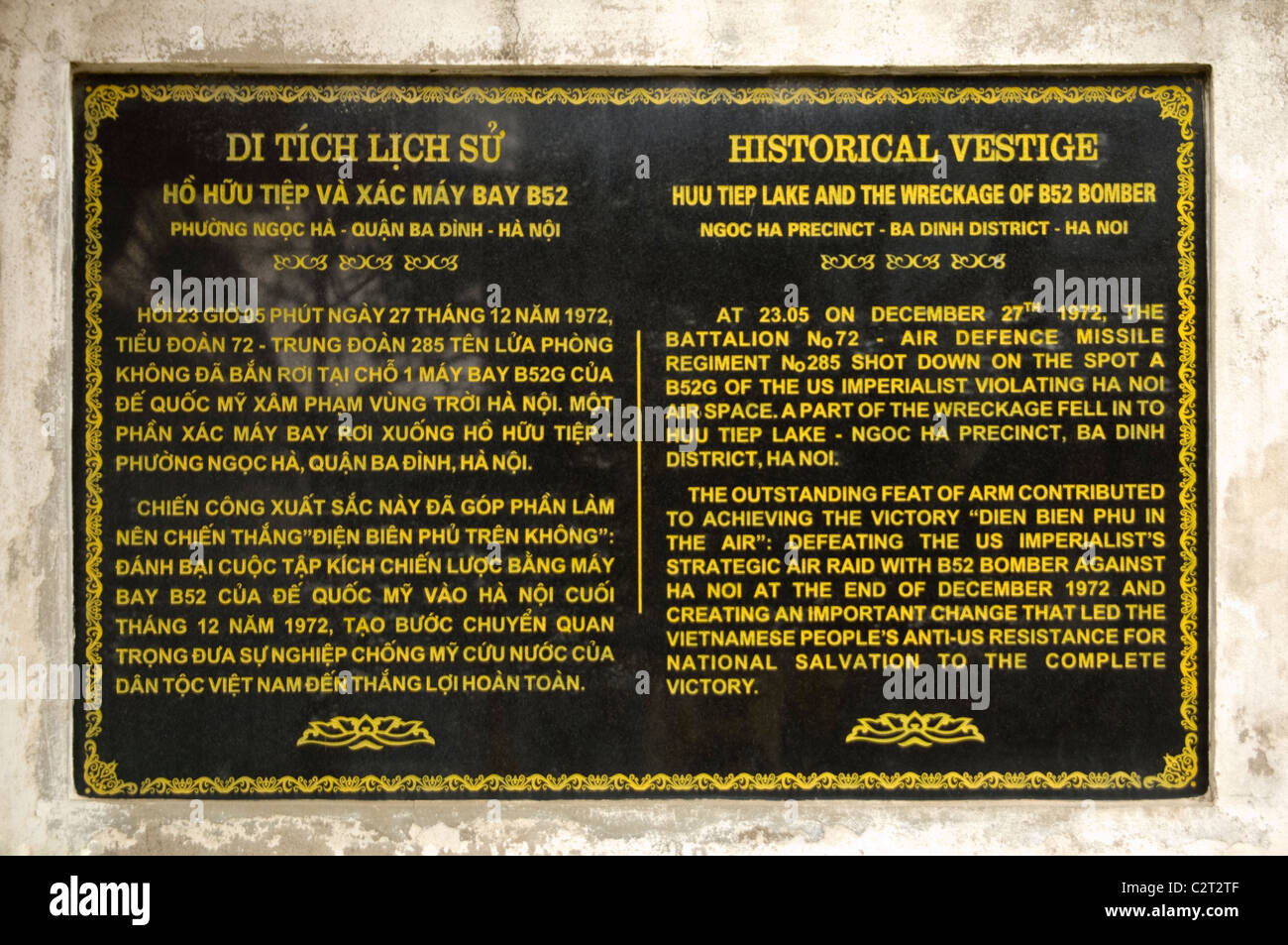 Horizontal close up of a plaque regarding the 'Christmas Bombings' of 1972 close to the wreckage of a B-52 bomber in Hanoi. Stock Photo