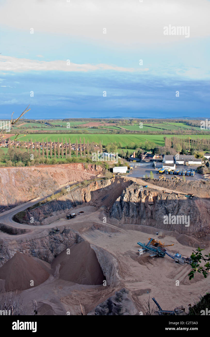 A quarry for rock, stone, sand and more; with heavy machinery Stock Photo