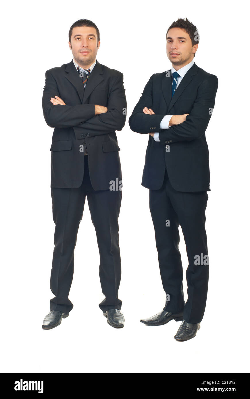 Full length of handsome two business men standing with arms folded ...