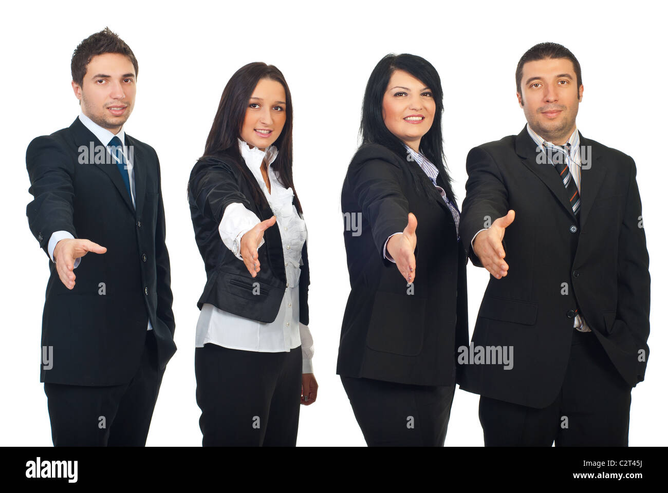 Row of four business people standing with hands open in welcome sign ...