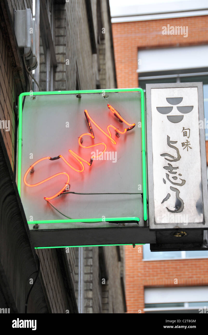 Sushi bar restaurant neon sign back alley alleyway Stock Photo