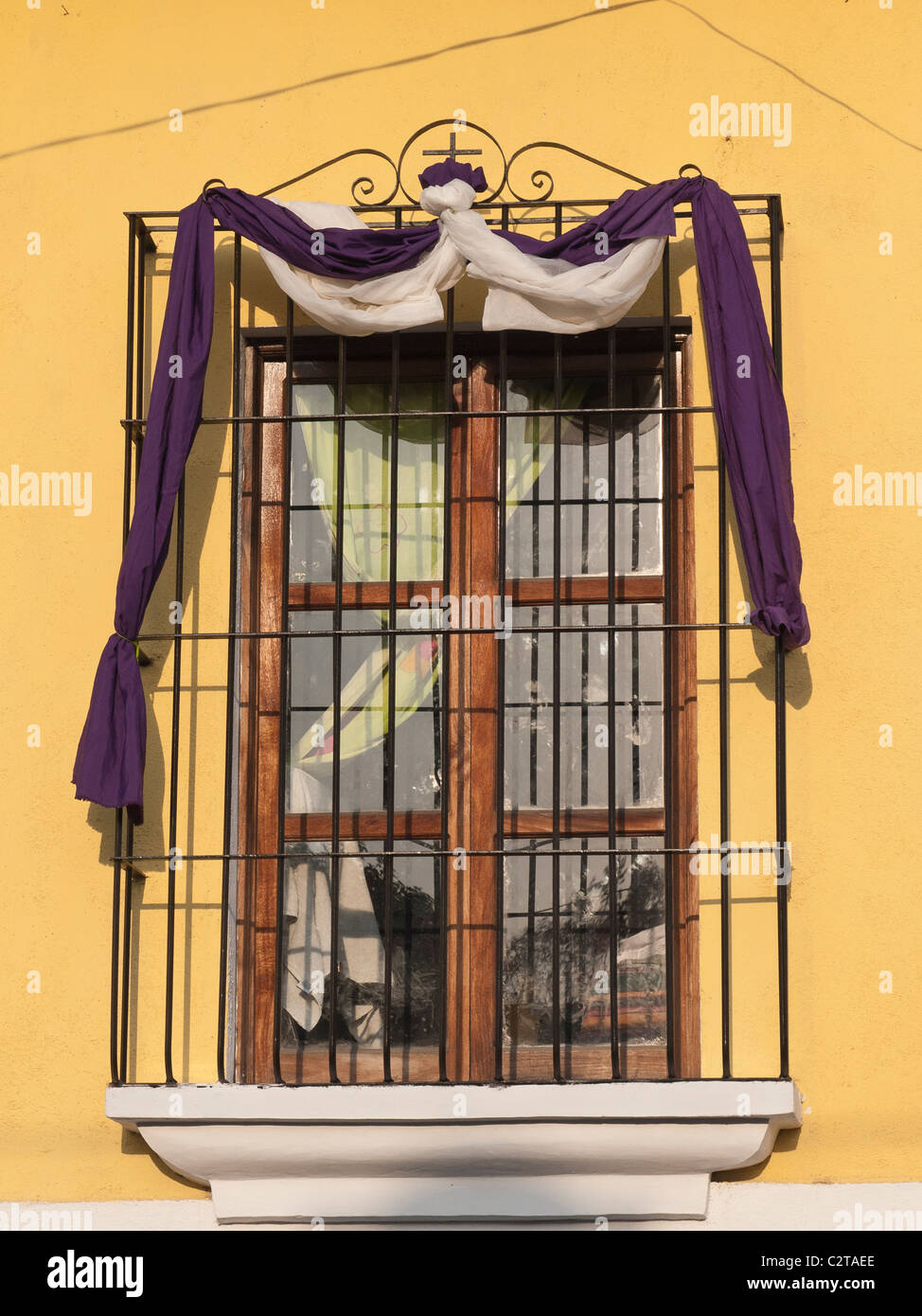 Purple and white drapes on a window celebrating Lent in the Spanish colonial city of Antigua