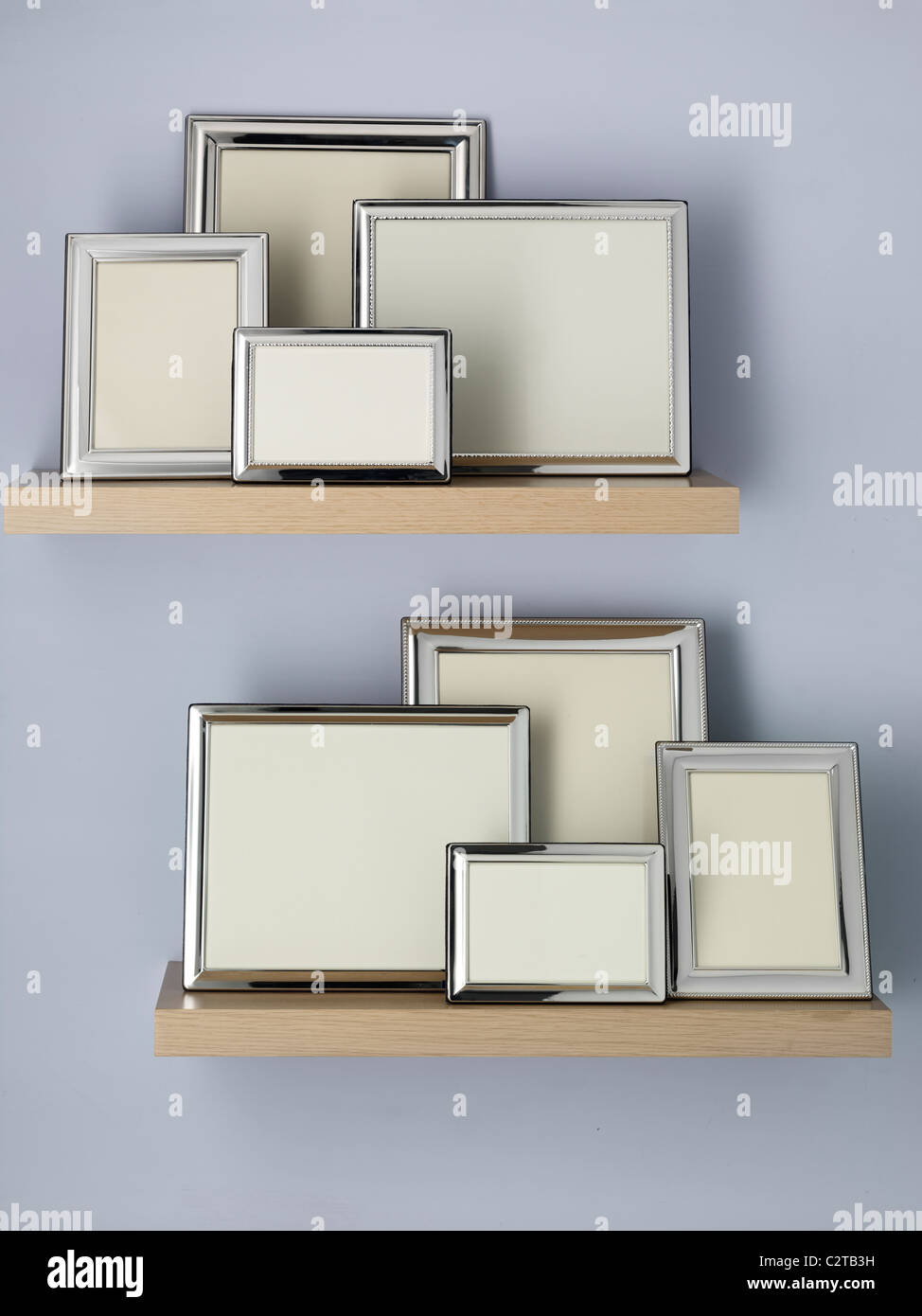 empty picture frames on shelves Stock Photo