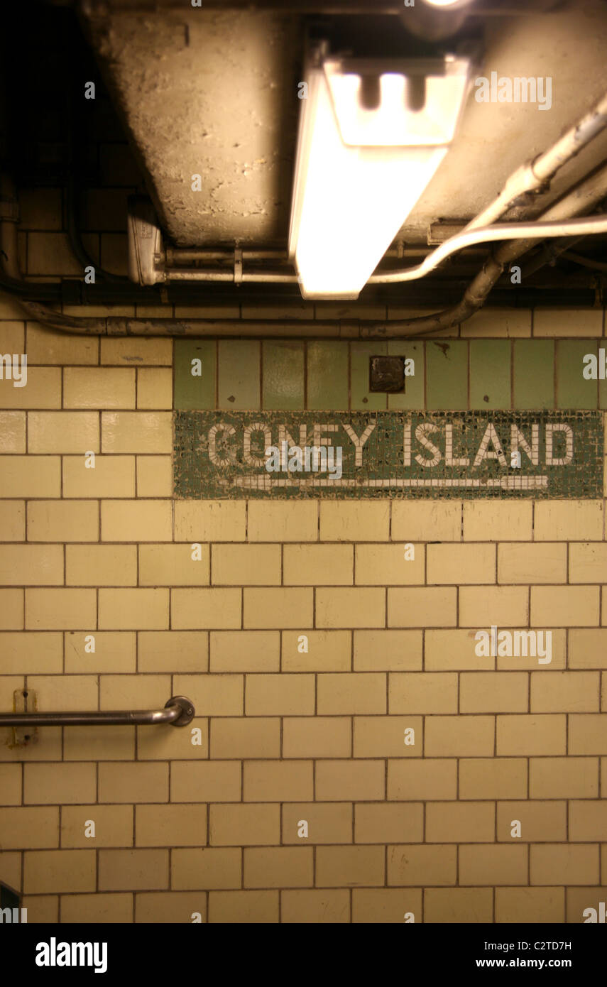 Sign pointing to Coney Island in subway station Stock Photo