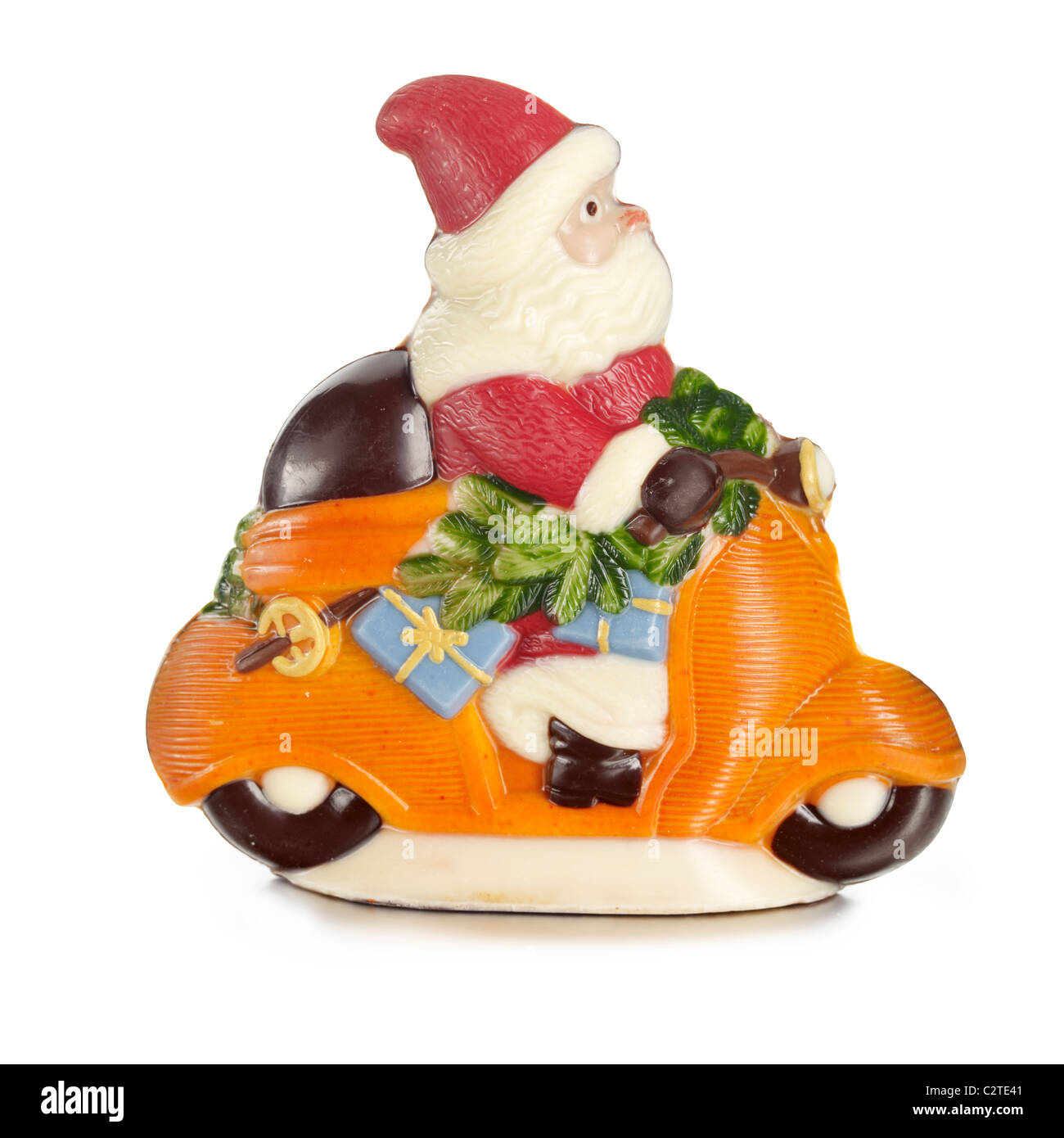 Chocolate father Christmas on orange scooter Stock Photo