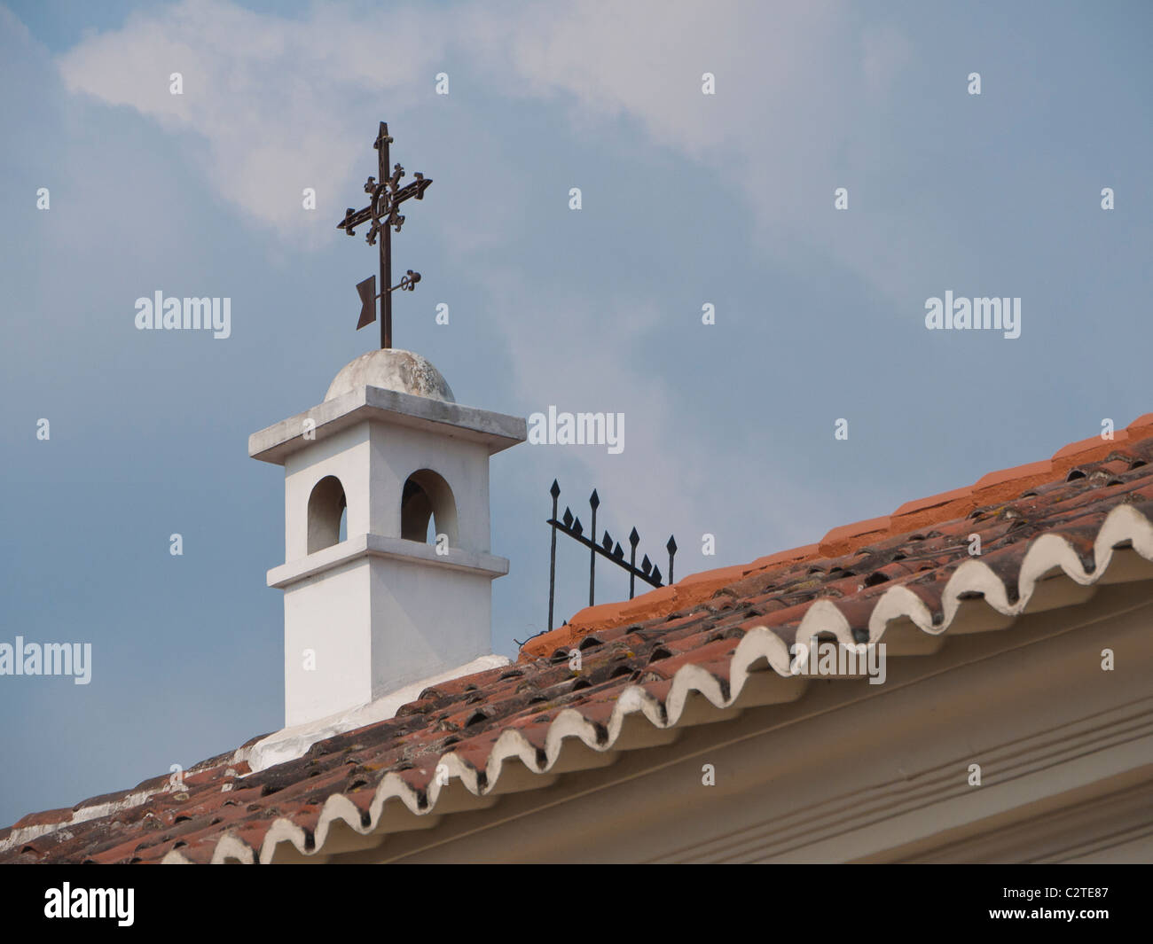 Detail of a weathervane in the shape of a Christian cross n the Spanish