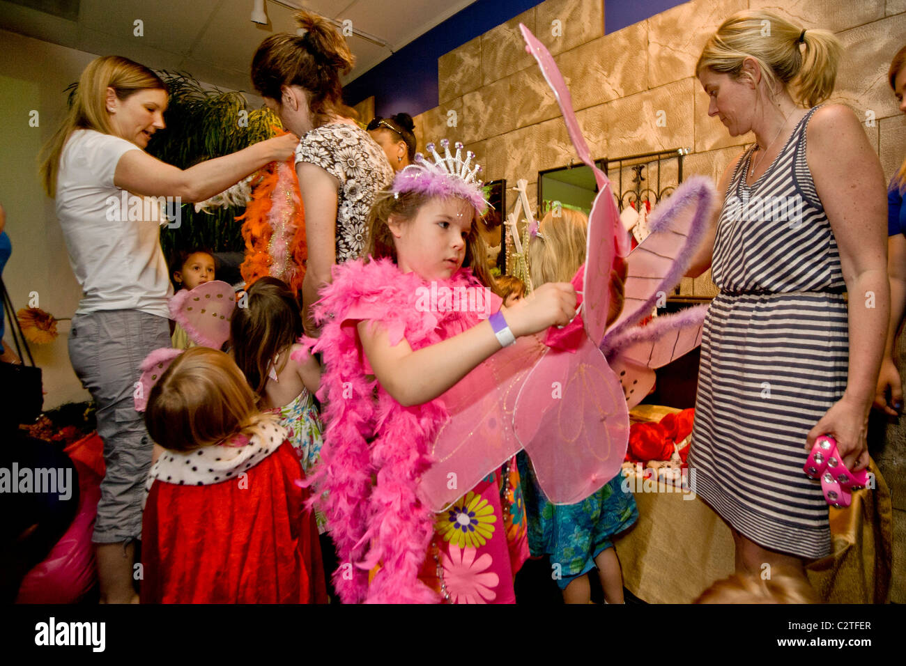 Five year old children dress up in angel wings at a birthday party held at a virtual reality video facility in Laguna Hill, CA. Stock Photo