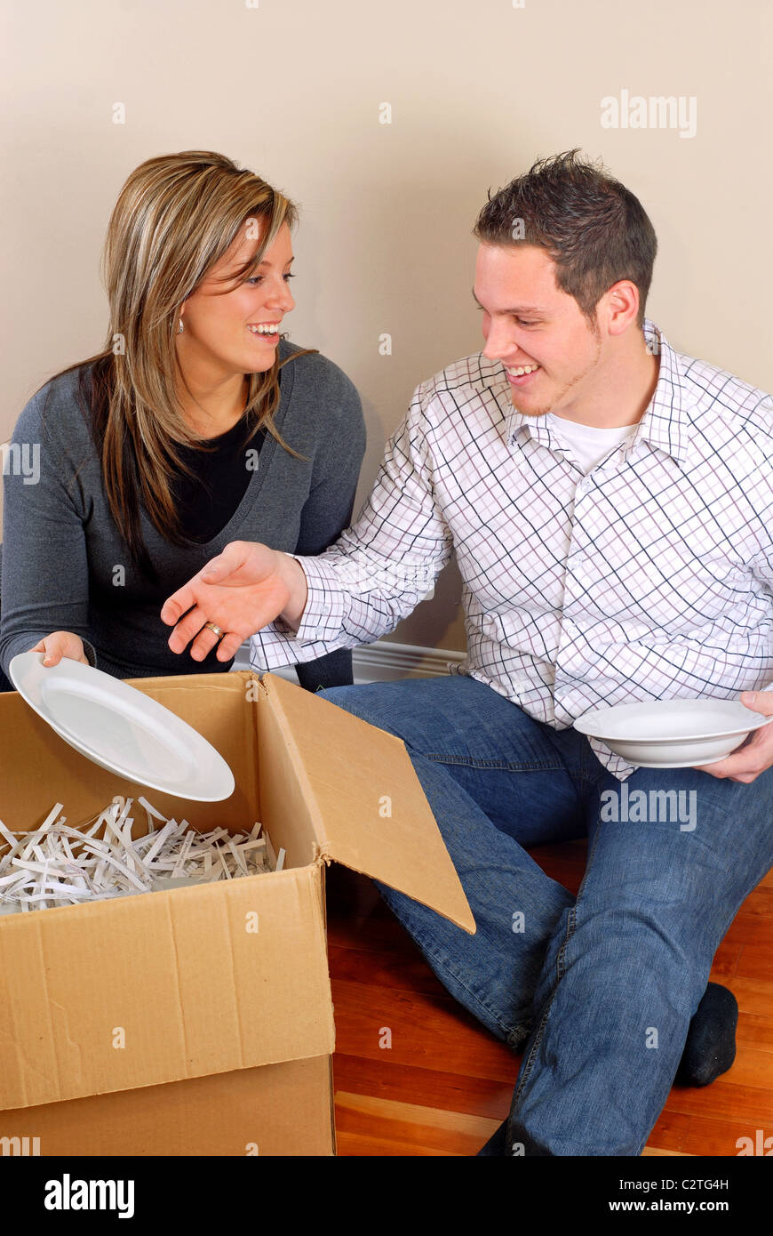 Woman packing moving box hi-res stock photography and images - Alamy