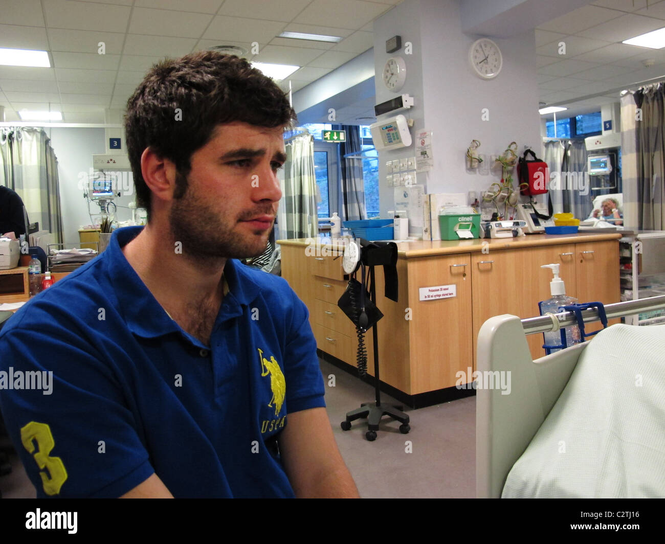young man upset visiting in hospital ward Stock Photo