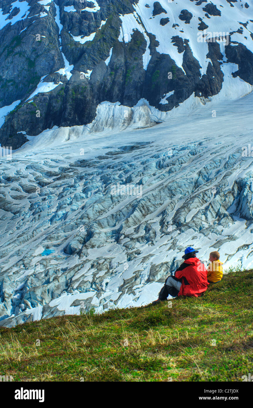 Father and son on the Harding Ice Field Trail overlooking Exit Glacier in Kenai Fiords National Park, Alaska Stock Photo