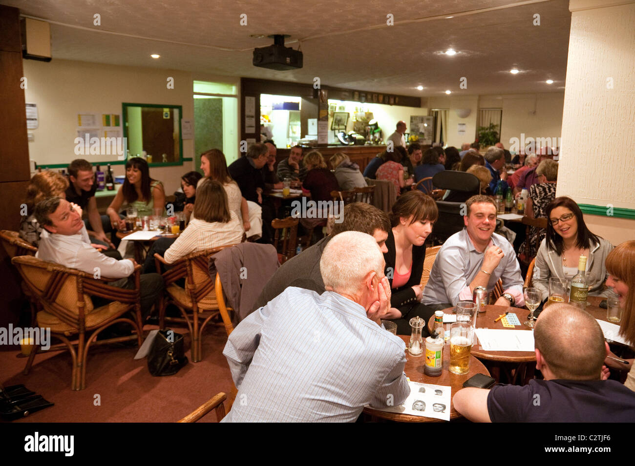 People enjoying a pub quiz to raise money for a local tennis club, Newmarket Suffolk UK Stock Photo