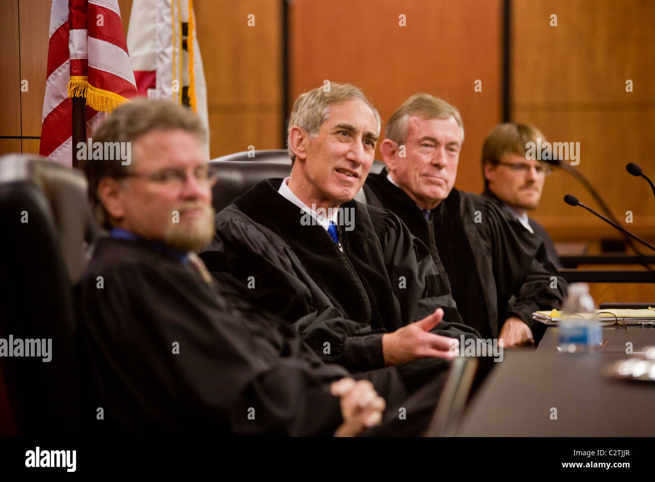 Panel of real judges responds to a student's argument at the law school of the University of California at Irvine moot court, Stock Photo
