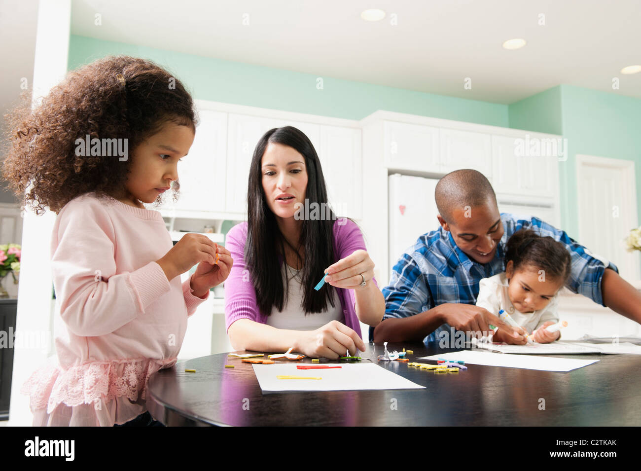 Family doing arts and crafts together Stock Photo - Alamy