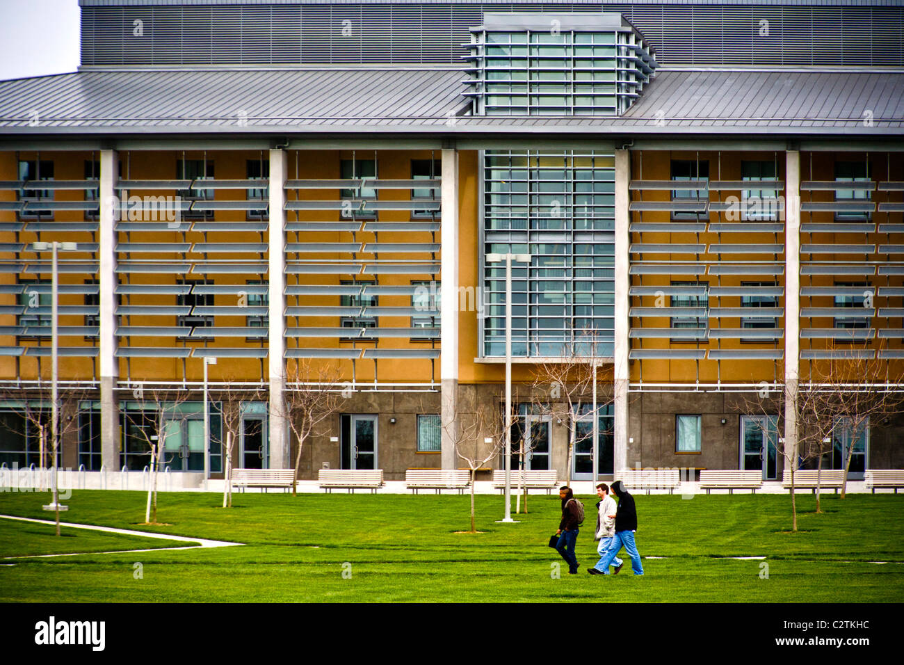 Students stroll outside the Leo and Dottie Kolligian Library  at the University of California, Merced. Stock Photo