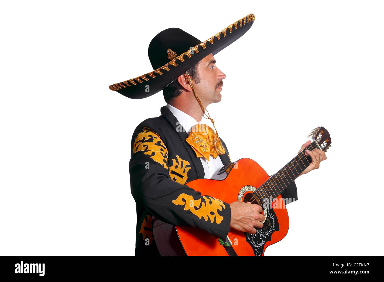 Charro mexican Mariachi playing guitar isolated on white Stock Photo