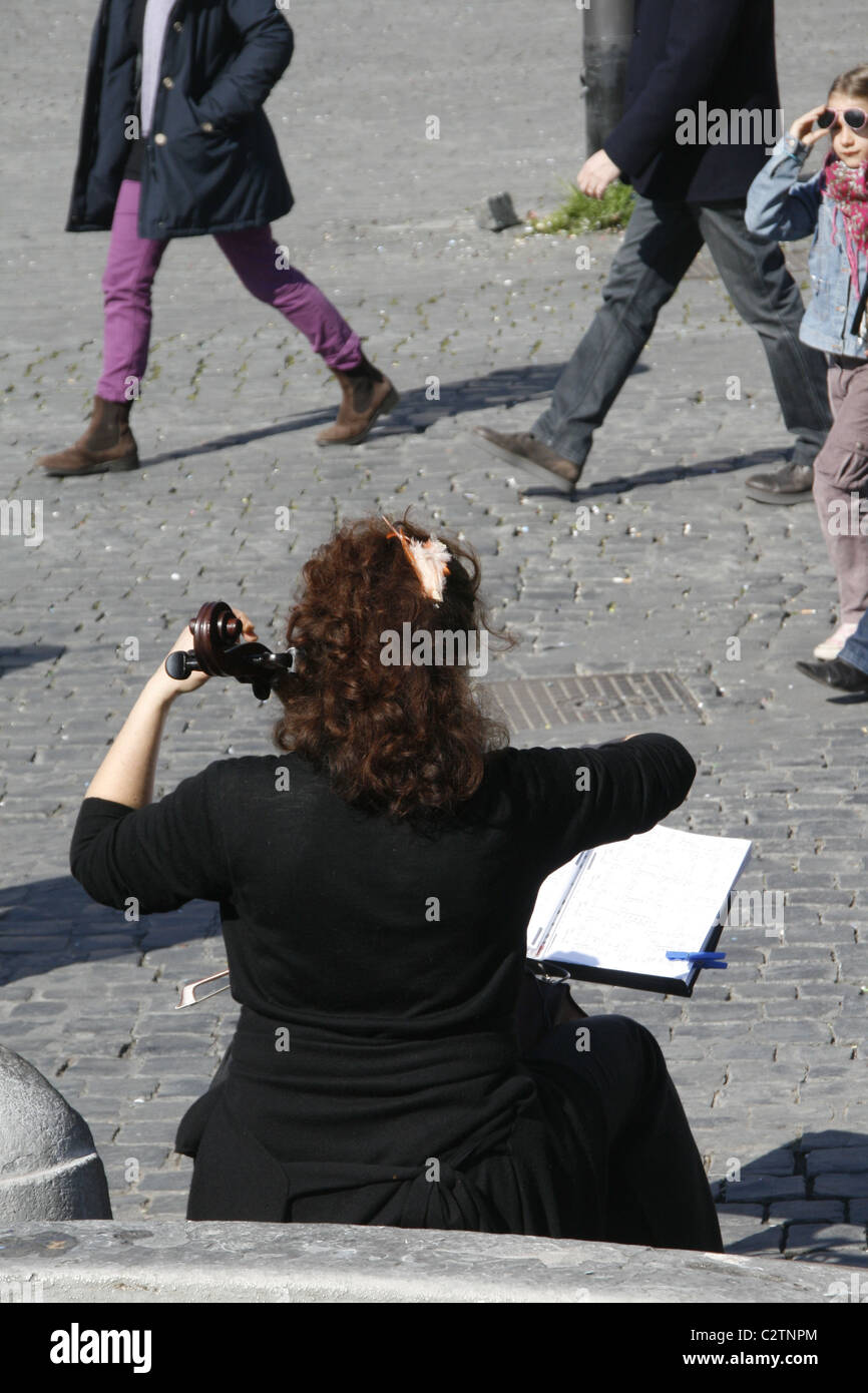 woman street entertainer busker player playing the viola musical ...