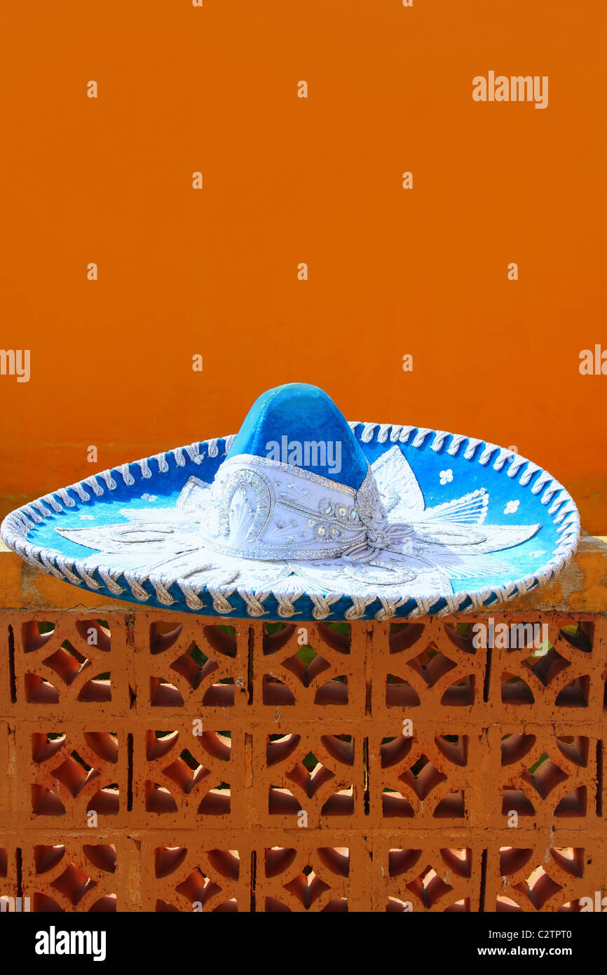charro mariachi blue mexican hat detail over orange background Mexico Stock Photo