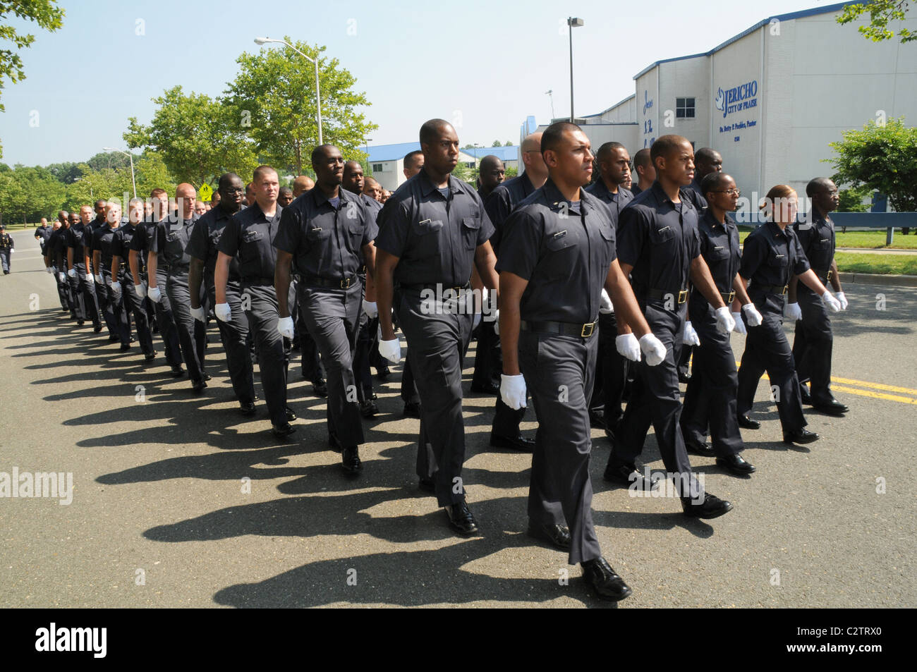Students from a police academy march to a church where a funeral for a slain Md state trooper is being held in Landover, Md Stock Photo