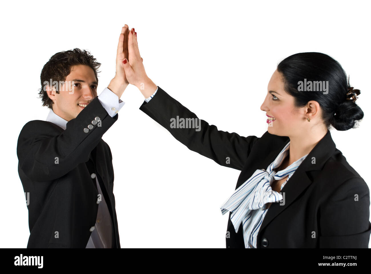 Businesspeople man and woman giving each other high five for successful ...