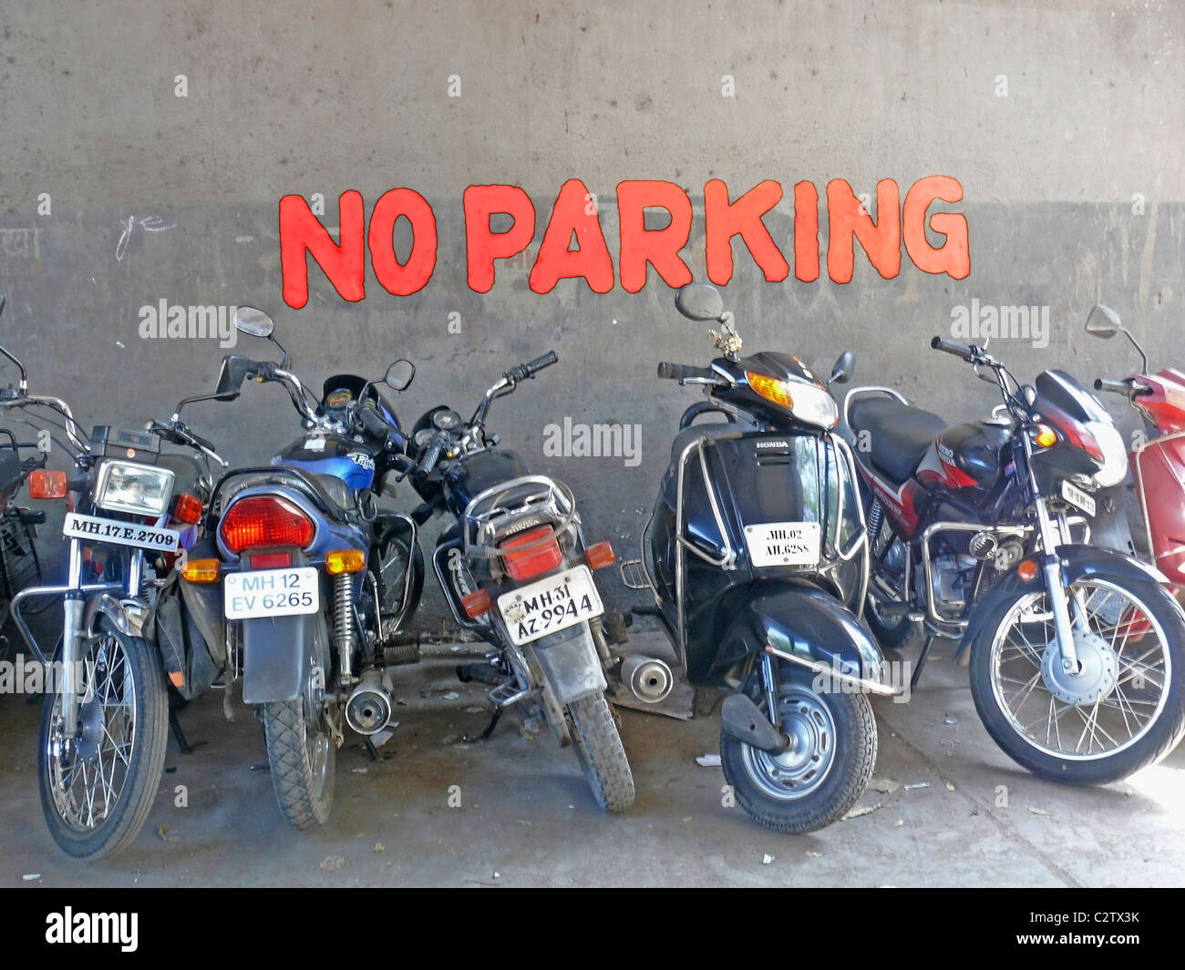 Motorcycles, bikes are parked at the place of No parking, Pune