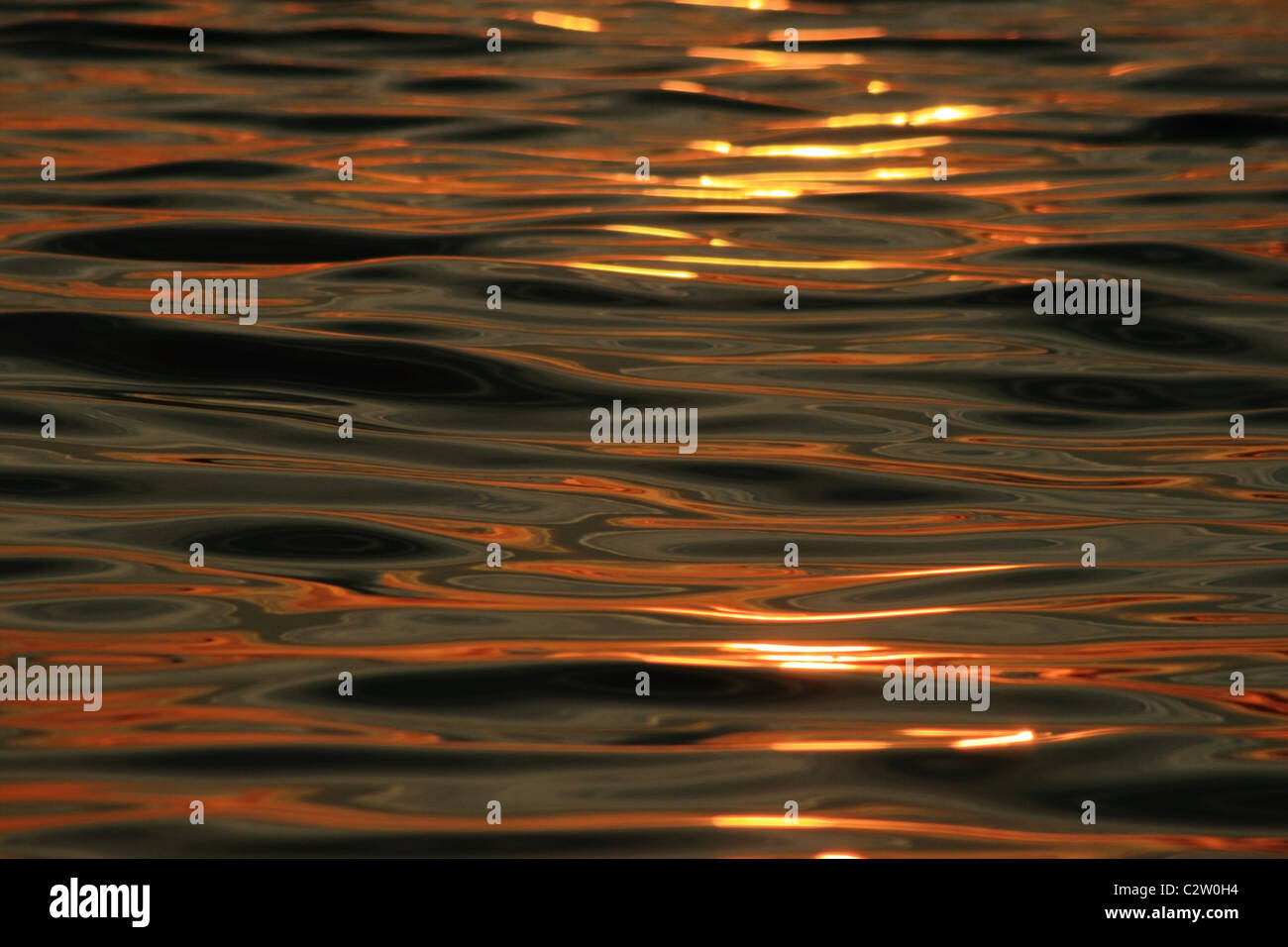 evening sunset reflection on rippling ocean water Stock Photo