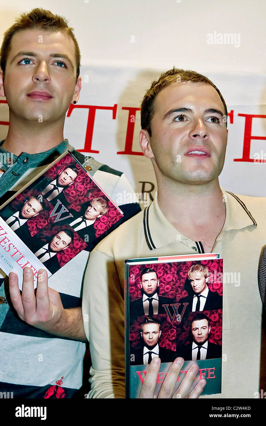 Mark Feehily and Shane Filan Westlife sign copies of their new autobiography 'Westlife - Our Story' at Waterstone's Liverpool, Stock Photo