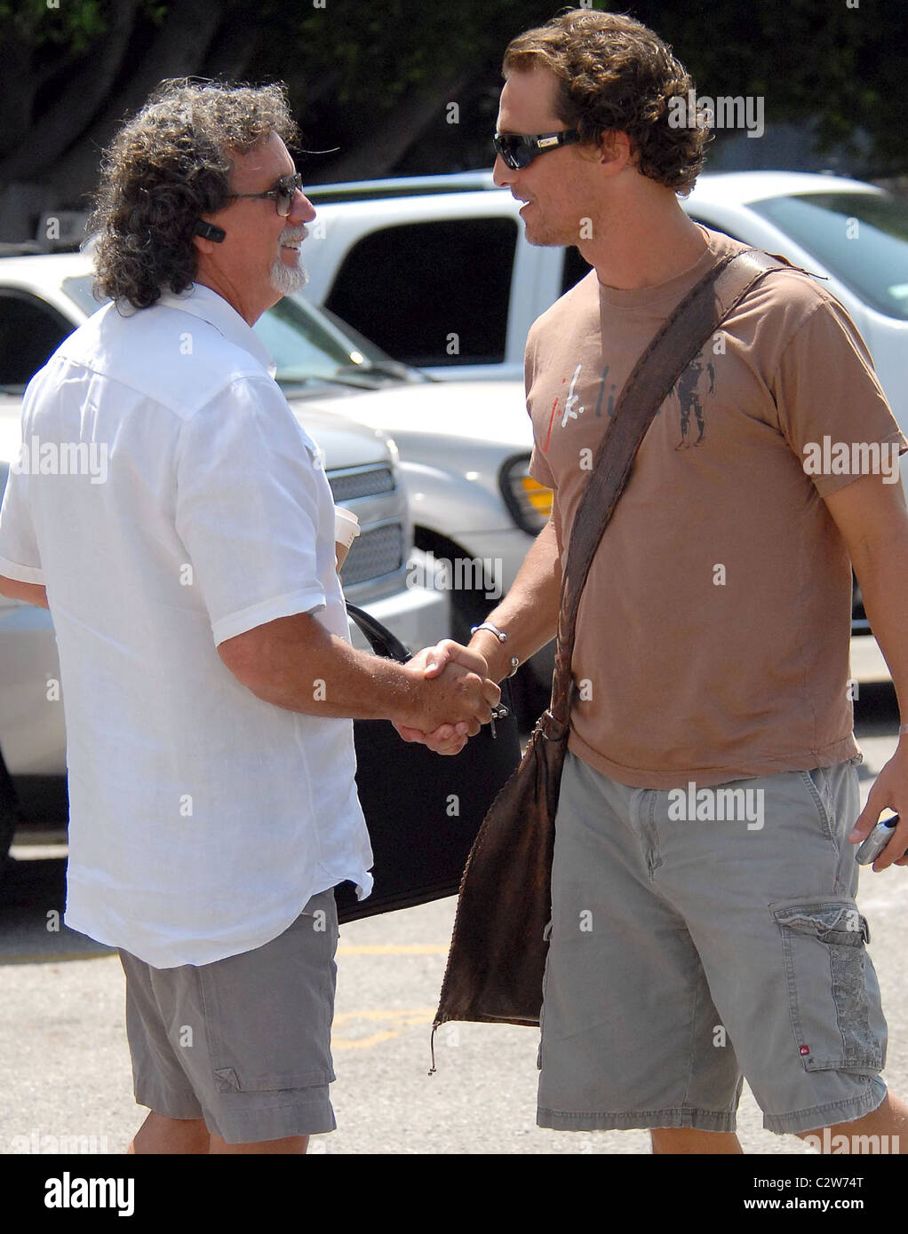 Matthew McConaughey and a friend walk to a movie studio Los Angeles