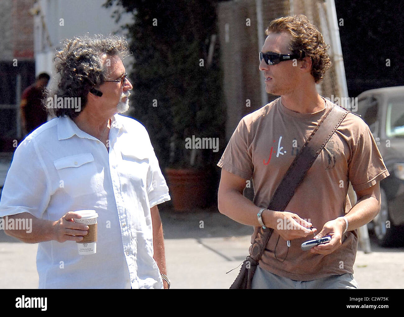 Matthew McConaughey and a friend walk to a movie studio Los Angeles
