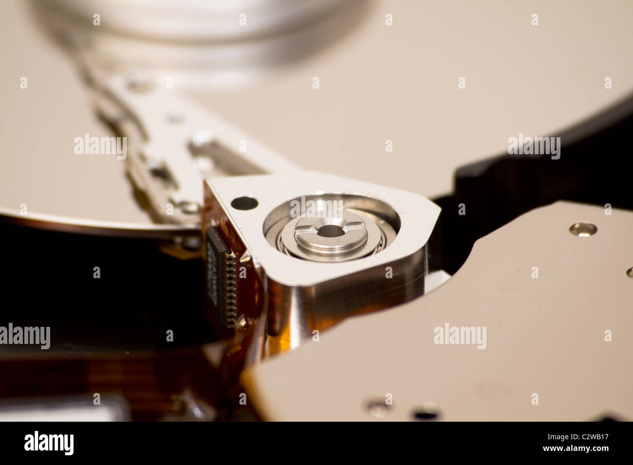 Close up of open hard disk drive, cylinders and heads Stock Photo