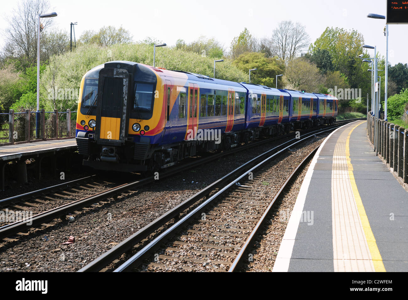 A commuter train at a quiet rural station Stock Photo Alamy