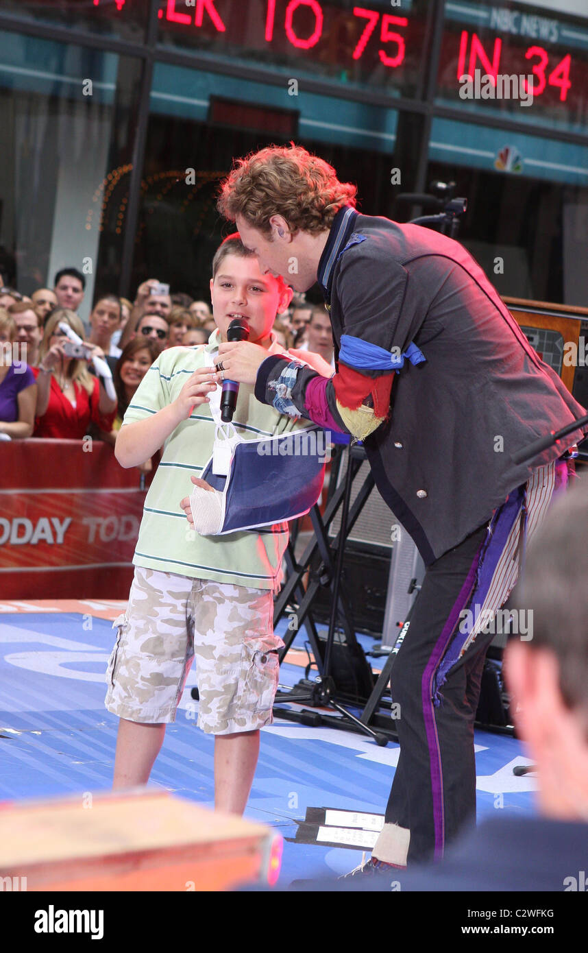 * MARTIN'S TREAT FOR INJURED FAN COLDPLAY rocker CHRIS MARTIN made a young fan's day, when he plucked him from the crowd during Stock Photo