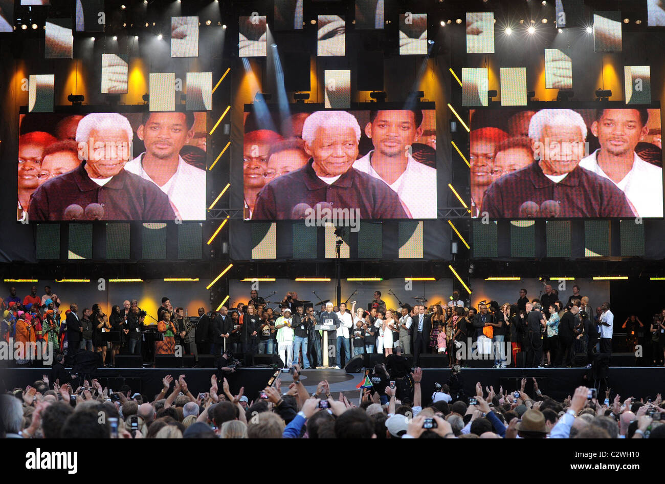 Nelson Mandela and guest on stage at Nelson Mandela’s 90th Birthday