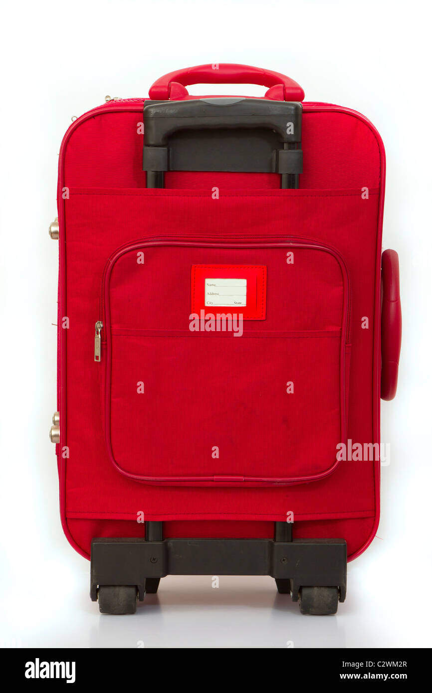 Red luggage isolated on white with tag Stock Photo
