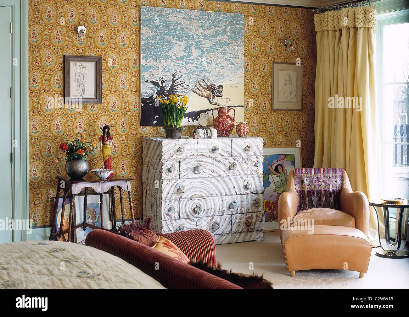 Eclectic modern art collector bedroom Stock Photo - Alamy