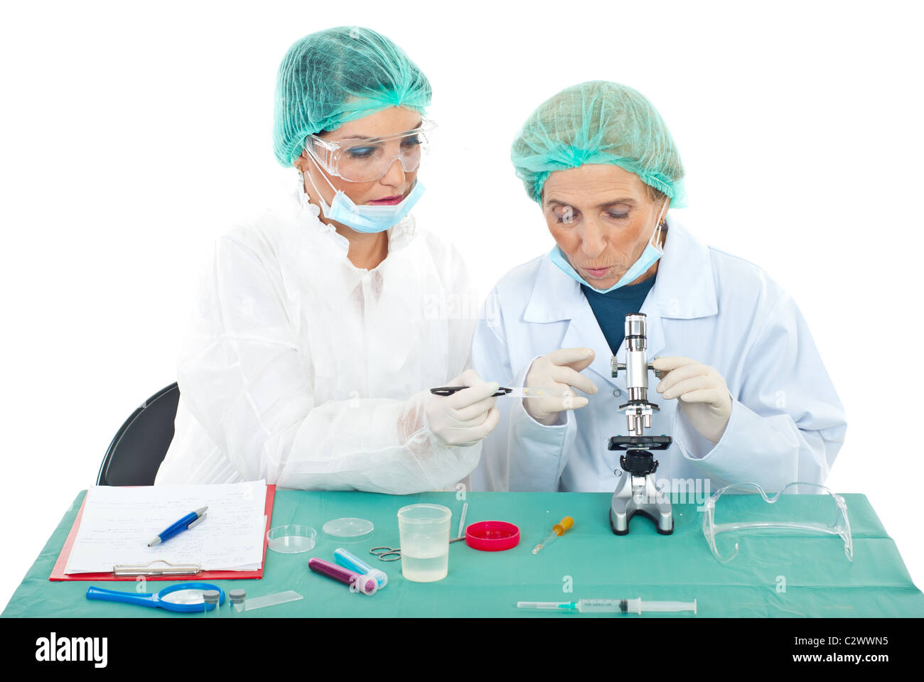 Two scientists females using microscope in laboratory Stock Photo - Alamy