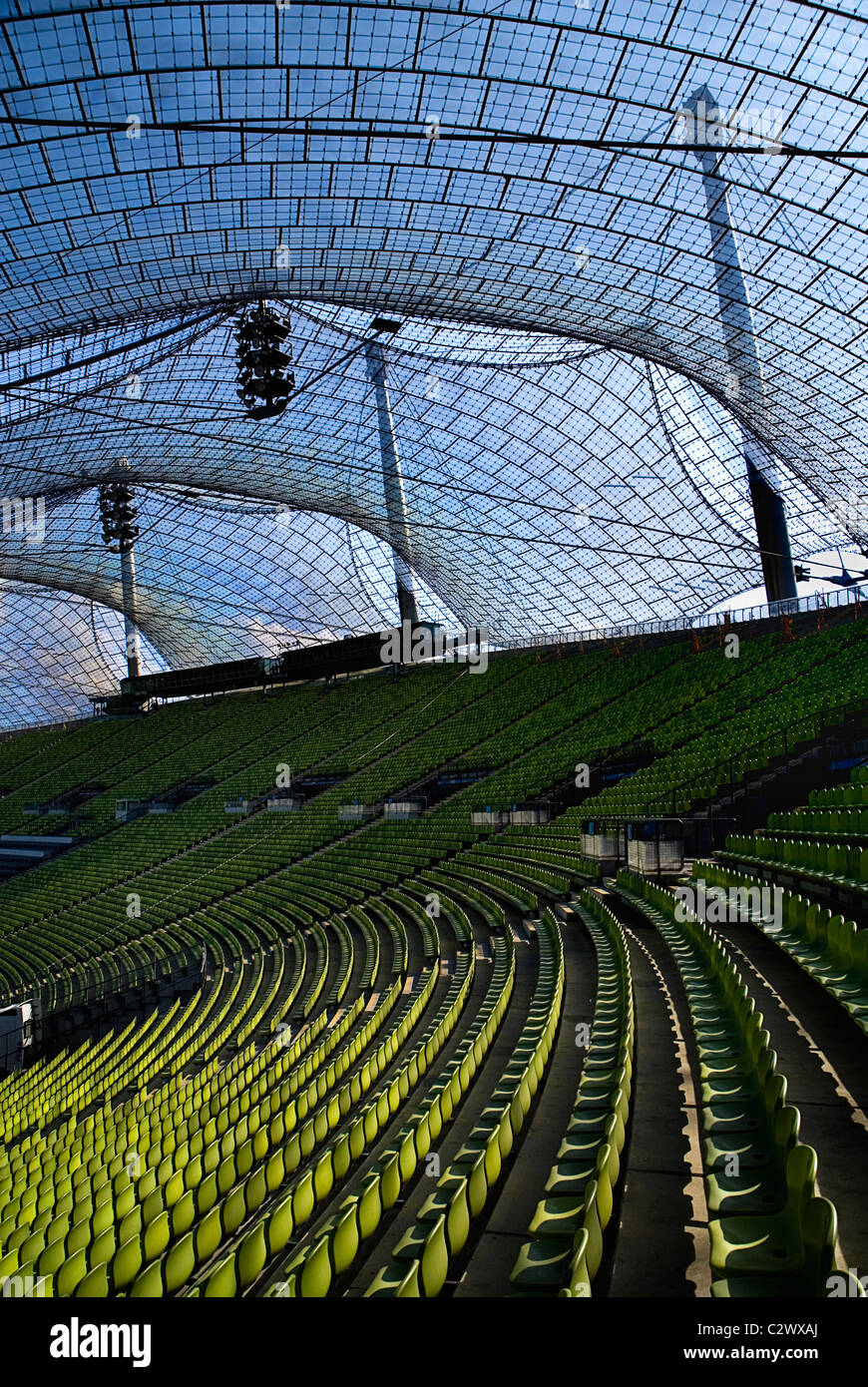 Germany Bavaria Munich 1972 Olympic Stadium curved section of bright green seating under canopies of acrylic glass Stock Photo