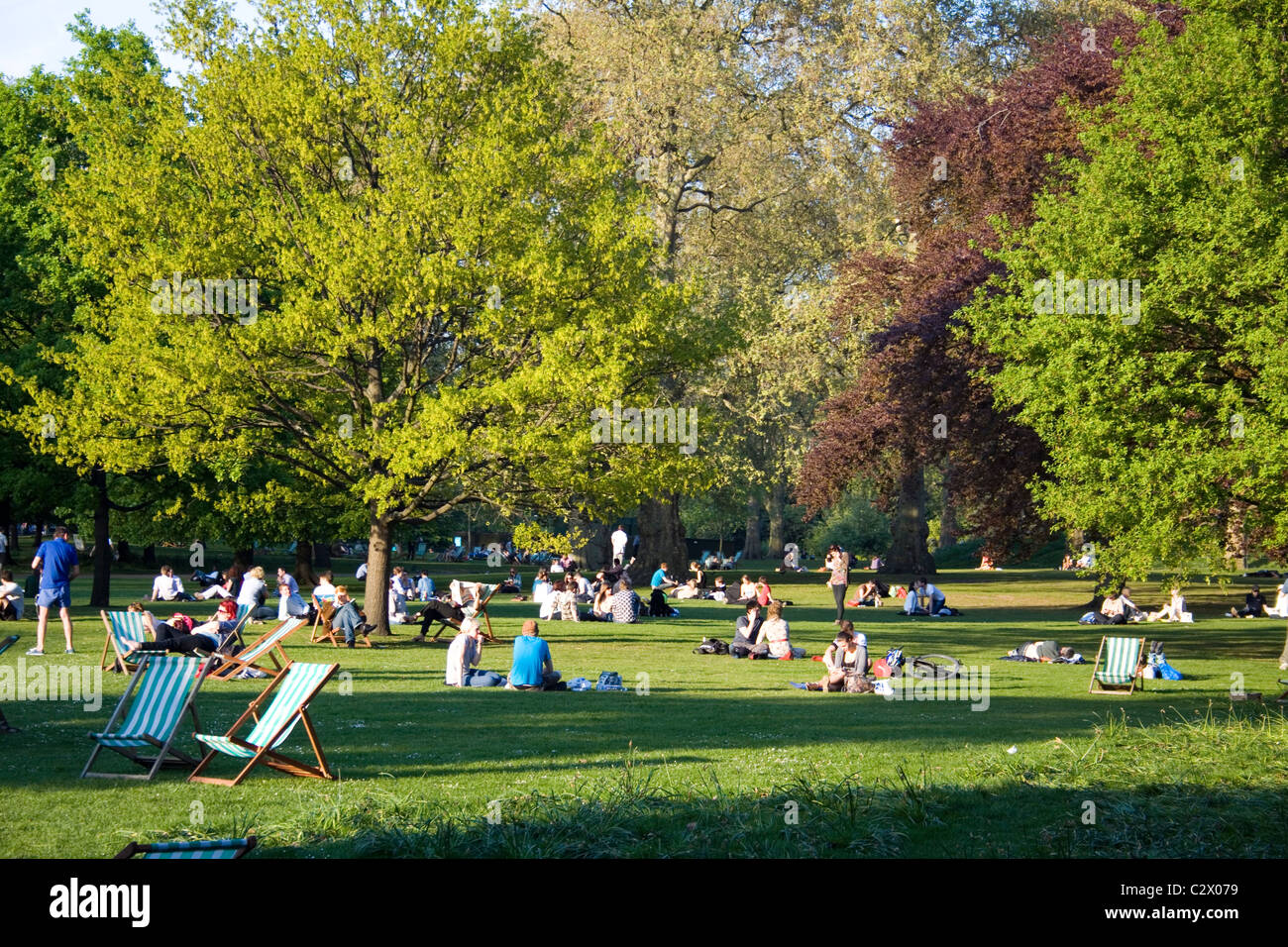People relaxing in St James's Park, London Stock Photo