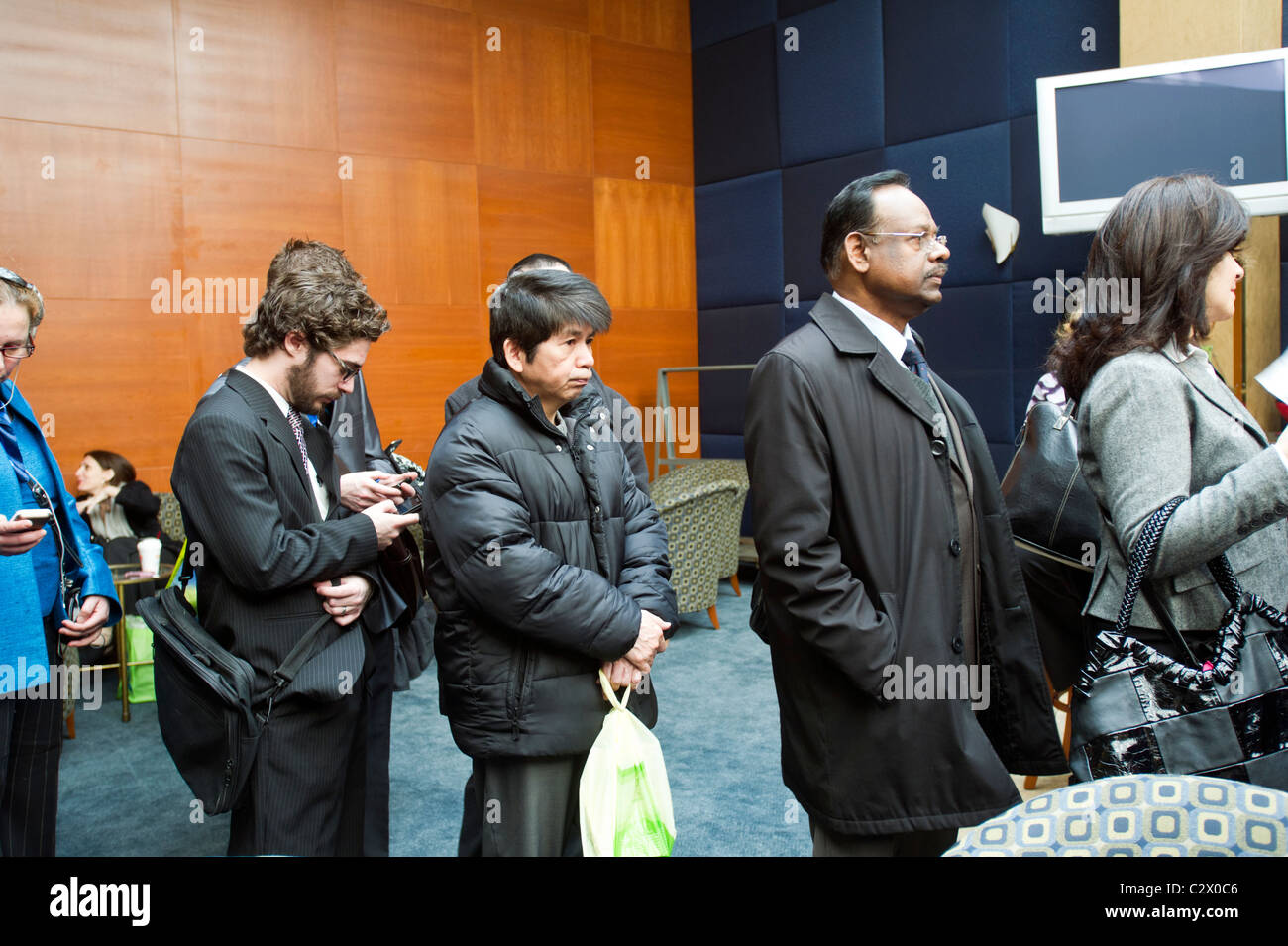 Job seekers line up for a job fair in midtown in New York on Monday, April 18, 2011. ( © Frances M. Roberts) Stock Photo