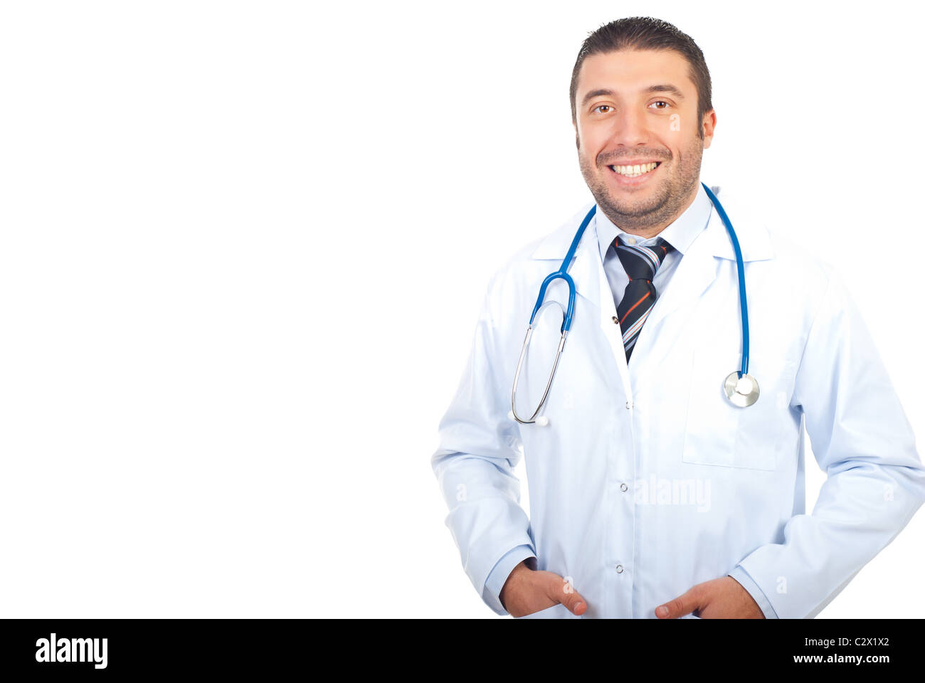 Friendly physician man holding hands in coat pockets isolated on white background,copy space for text message in left part Stock Photo