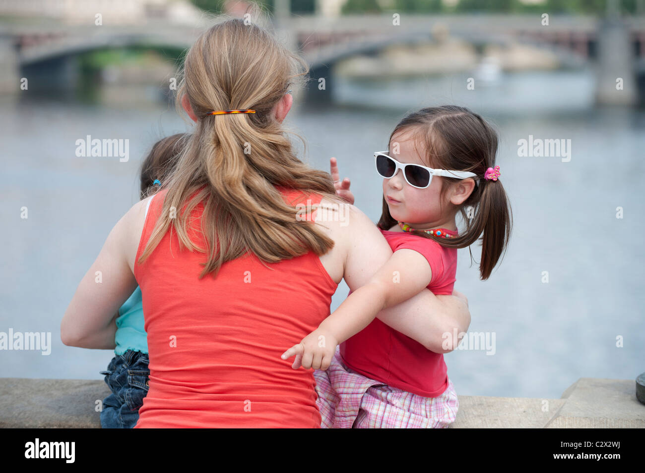Small girl with mother showing something Stock Photo