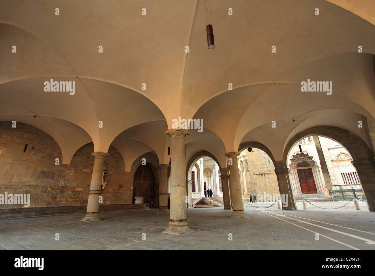 Italy, Lombardy, Bergamo Old Town, Piazza Vecchia, Under the Palazzo della Ragione Stock Photo