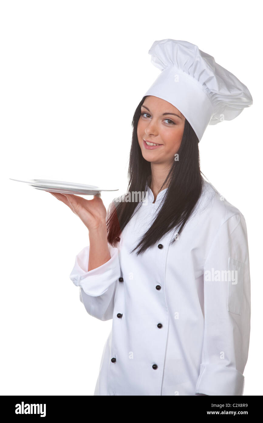 Young female cook holding silver tray Stock Photo