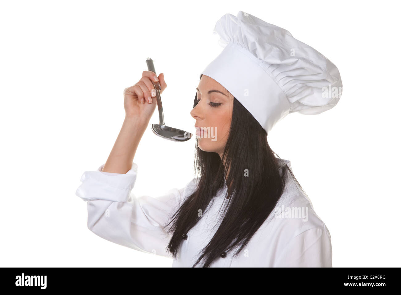 Young cook student tasting her meal Stock Photo